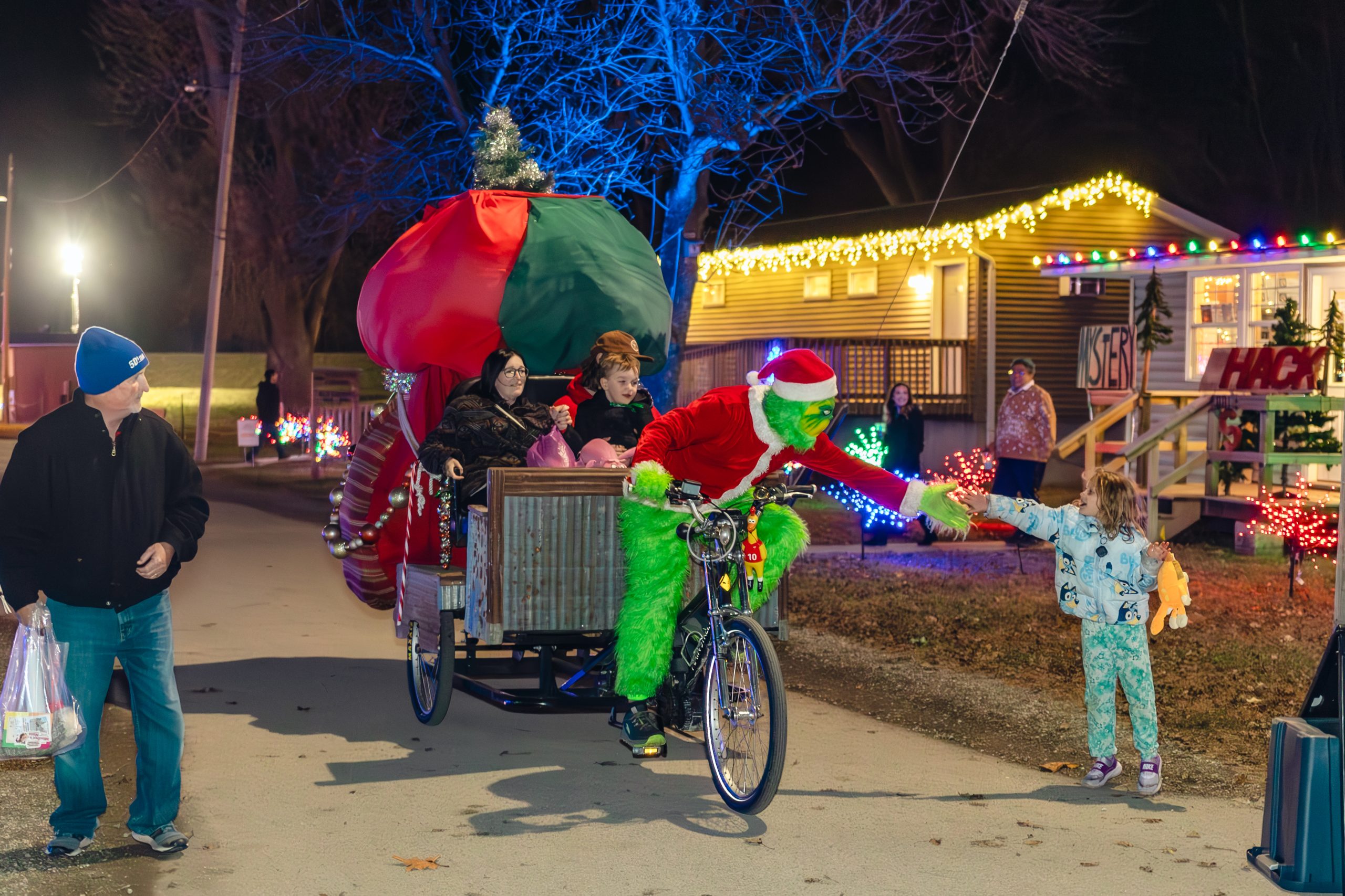 The Grinch meeting kids at Falconwood Frosty Nights